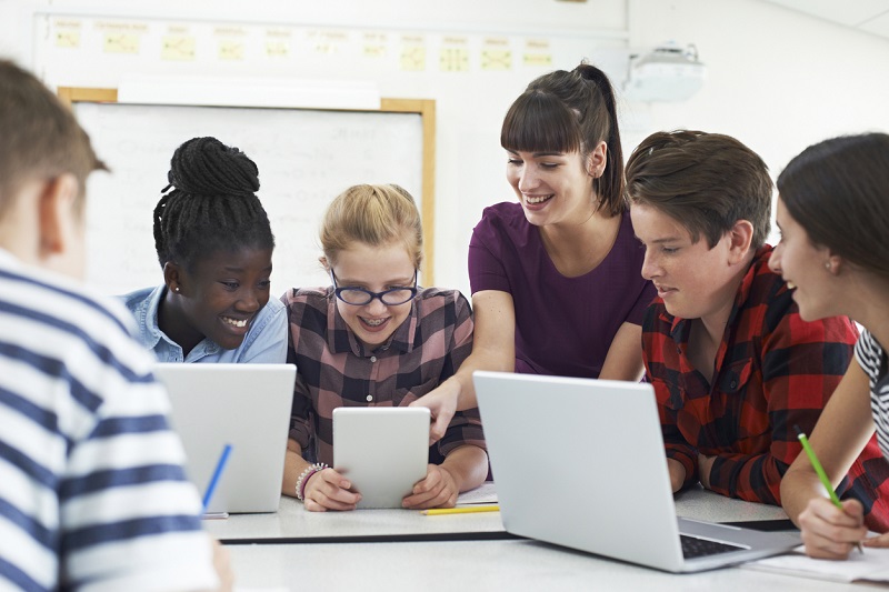 Teacher working with students to build their voices to create change.
